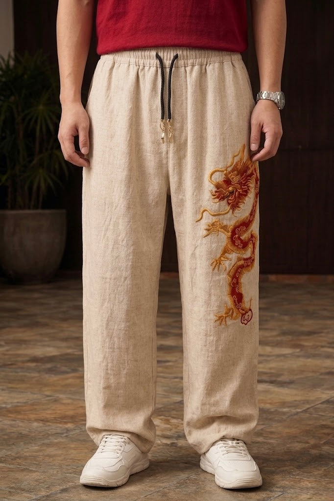 Beige Chinese dragon baggy pants for unisex with red and gold 3D embroidery by Banstore.
