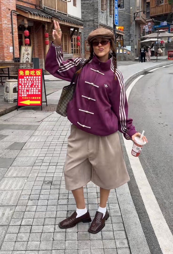 Model styling the wine purple streetwear bomber for an urban streetwear look
