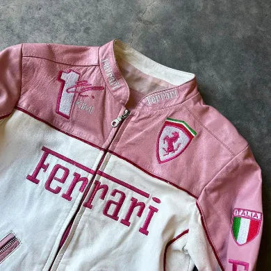 Pink and white leather biker jacket with Ferrari logo patches and racing-inspired embroidery.