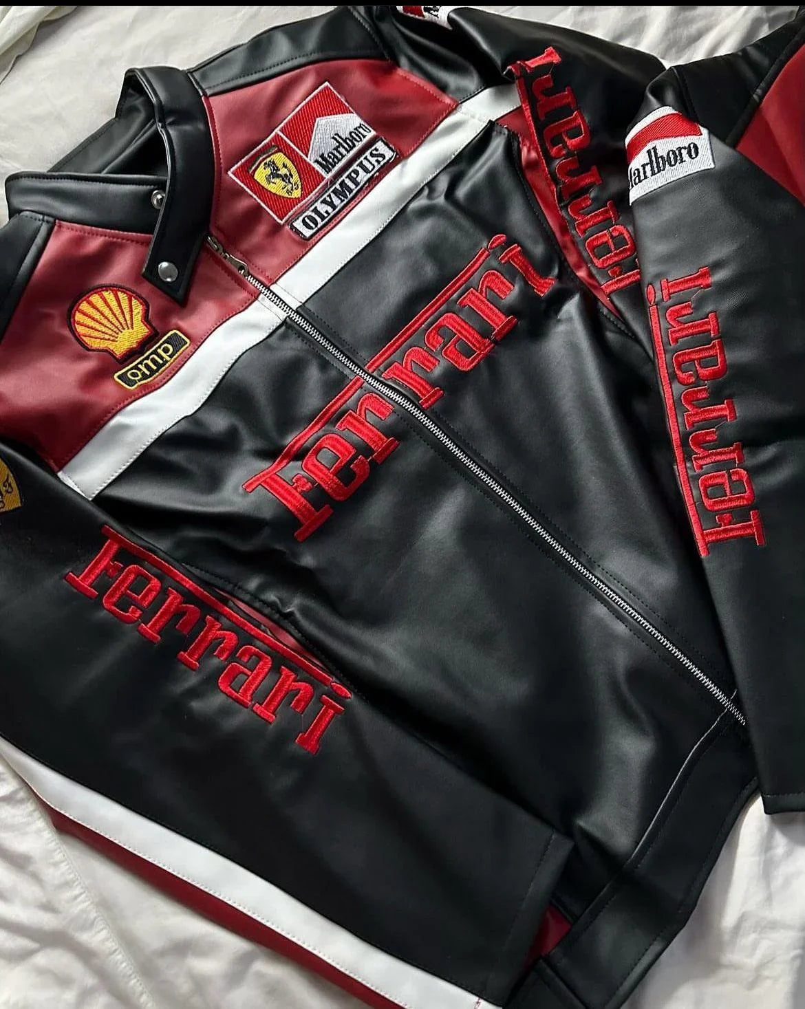 Black and red leather biker jacket with Ferrari and racing-inspired embroidered patches